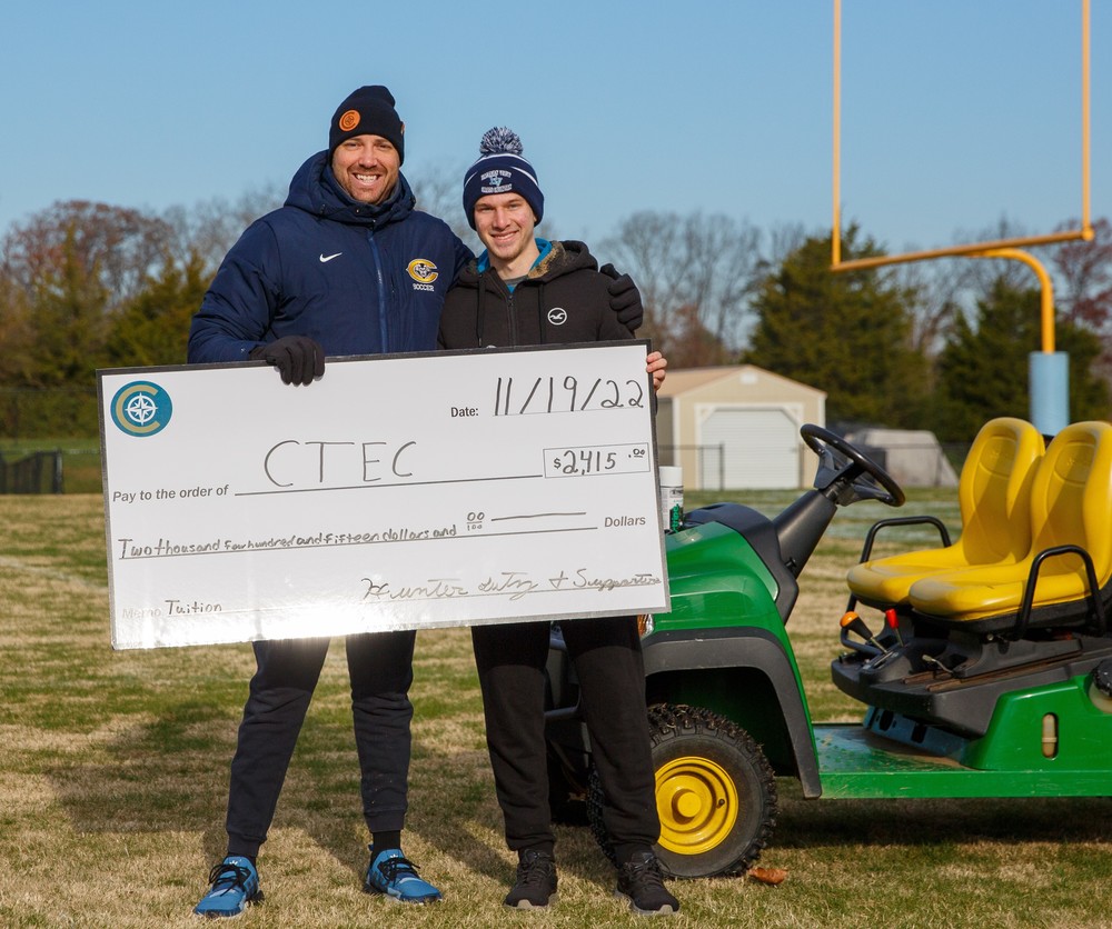 Hunter Lutz presents Principal with big check