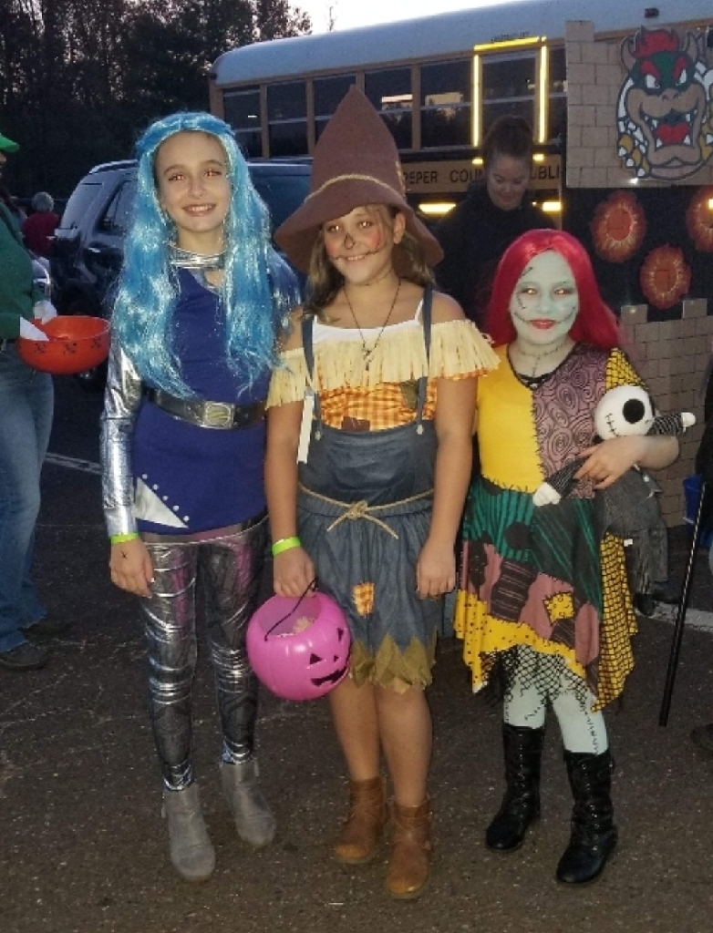 Students in costume at trunk or treat