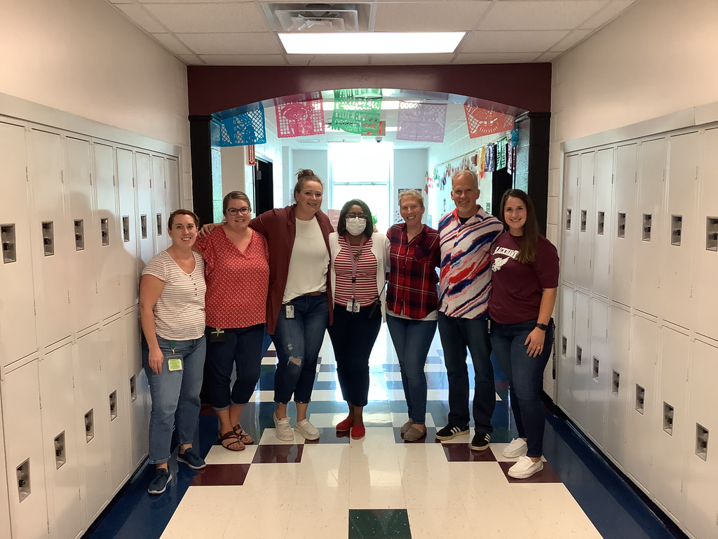 A picture of the 8th grade teachers dressed in patriotic apparel
