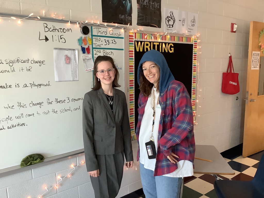A picture of a student dressed like a teacher and Mrs. Carroll dressed like a student