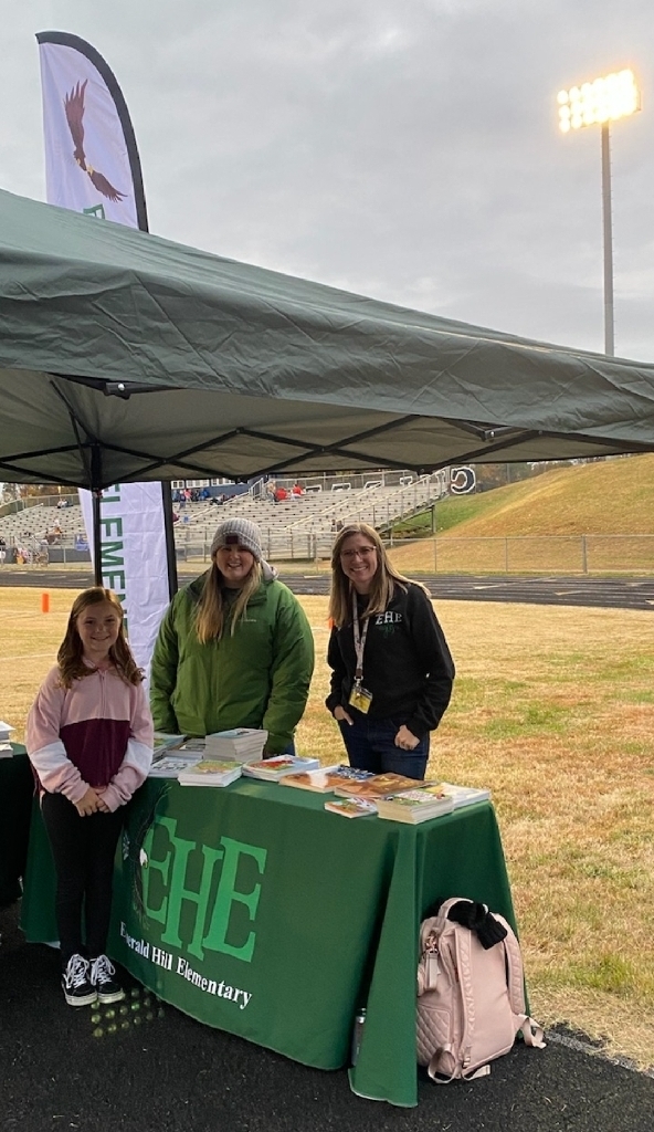 Dr. Gelbert and Mrs. Lane with student at CCHS football field