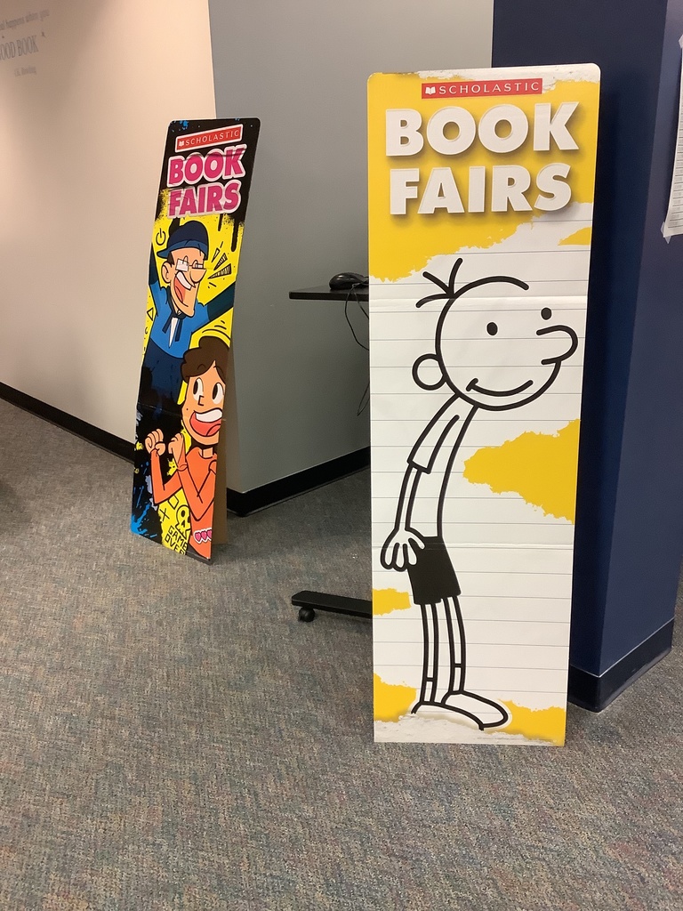 A picture of diary of a wimpy kid poster with "scholastic book fairs" title.