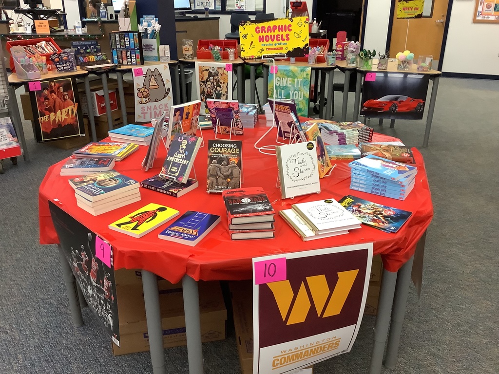 A photo of a specific book fair table with books displayed.