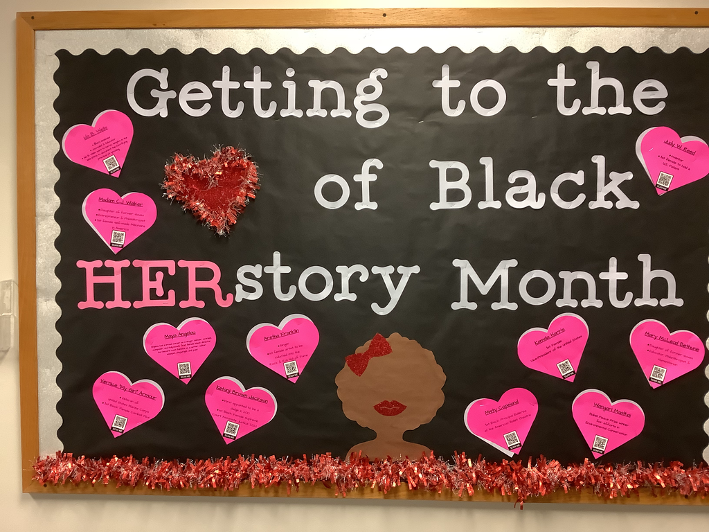 A bulletin board with Black "Her-Story" Month and hearts with notable African American women.