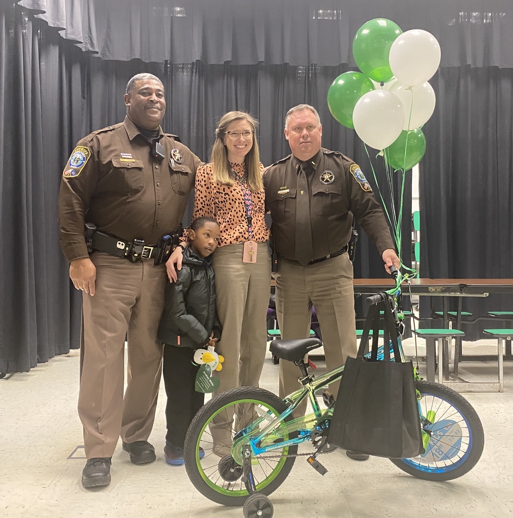 Principal, Deputies with student and bicycle