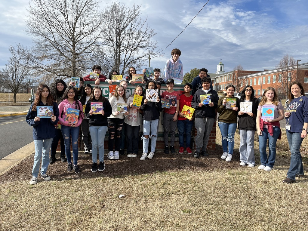 A picture of the Spanish Class outside by the Sycamore Park Elementary Sign