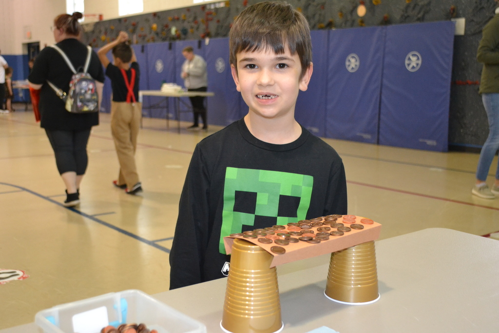 Students competed to build the bridge that would hold the most pennies.
