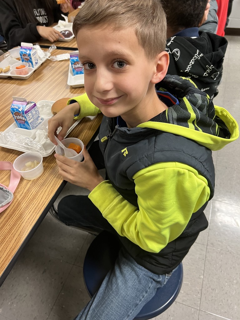 child eating butternut squash