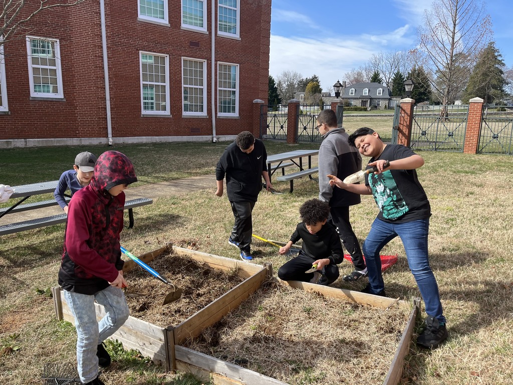 A picture of students starting a raised bed garden