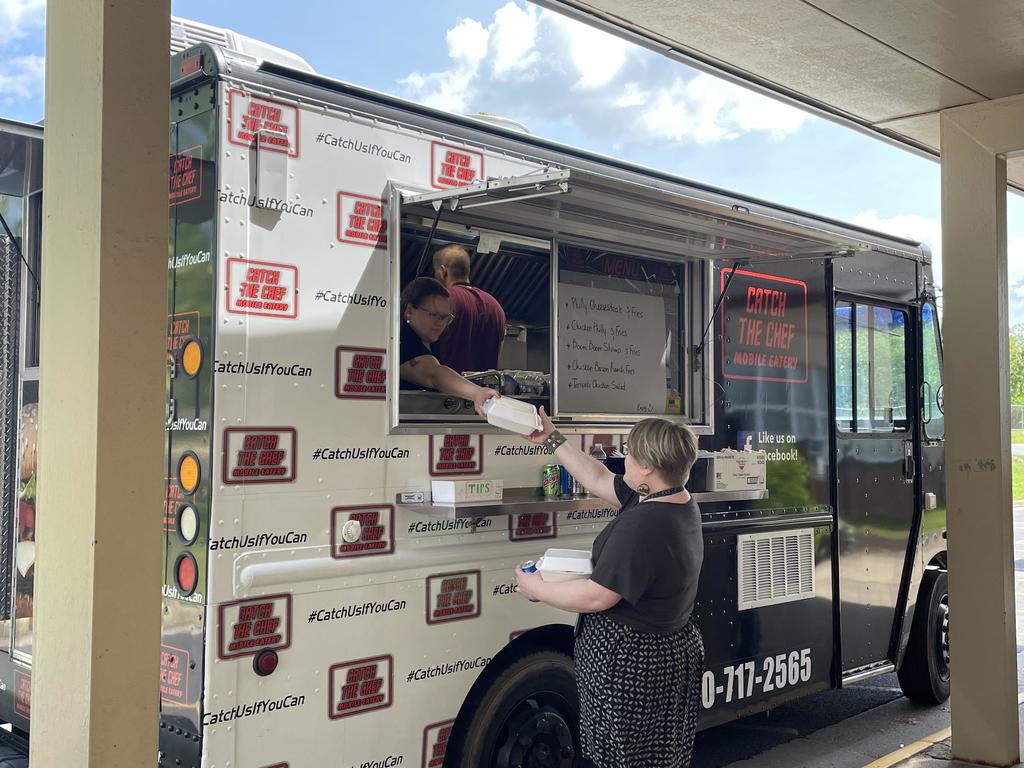 teacher getting lunch from food truck