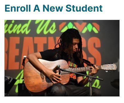 A picture of a student playing guitar