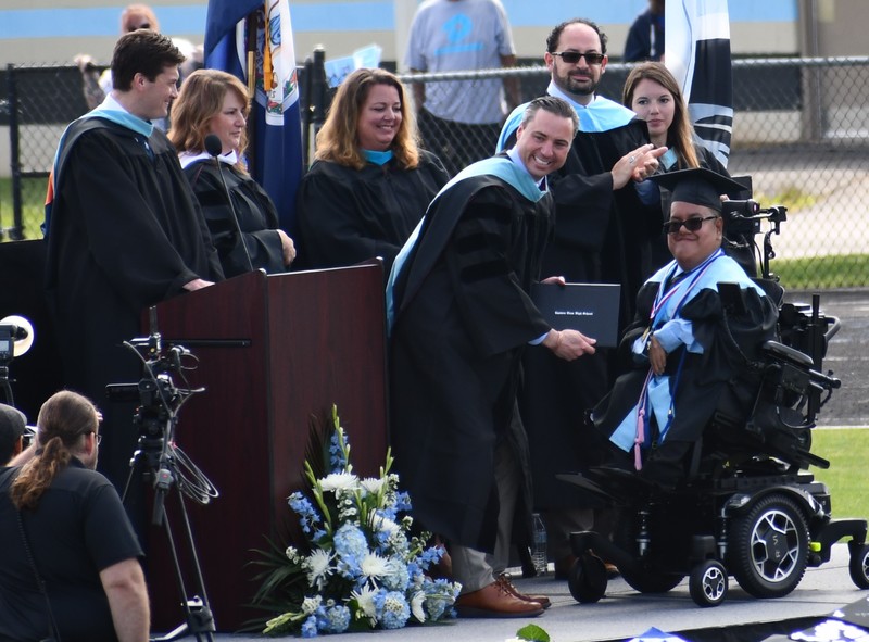 Diego Jimenez receives his diploma from Principal Dr. Nate Bopp